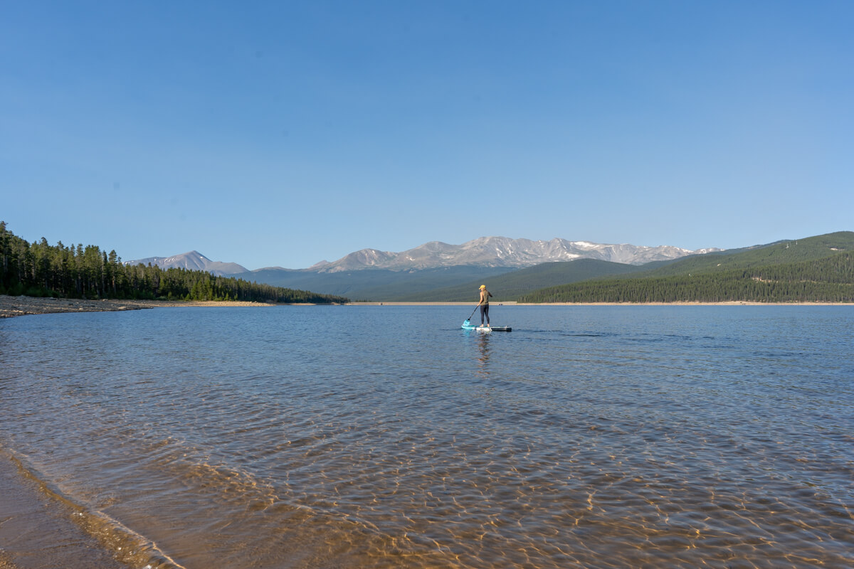 A distant paddle boarder exploring the expansive waters at Turquoise Lake in Colorado