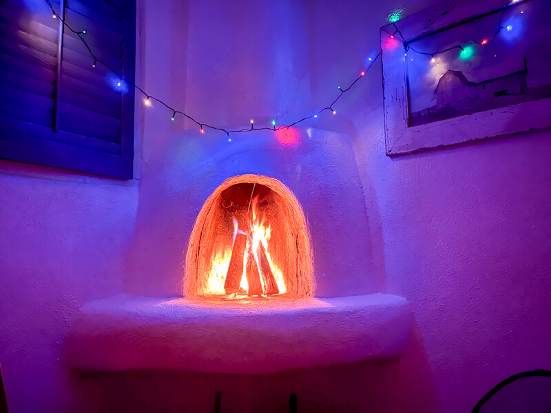 A cozy fire in the kiva fireplace at the Historic Taos Inn. 