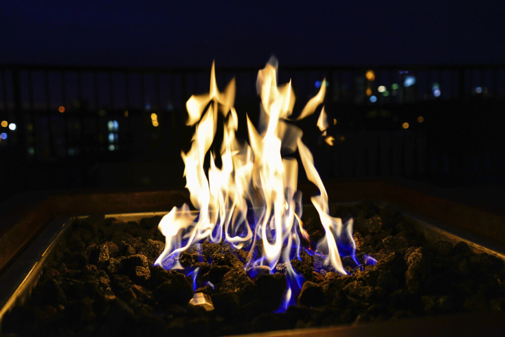 Flames from a fire pit at night. 